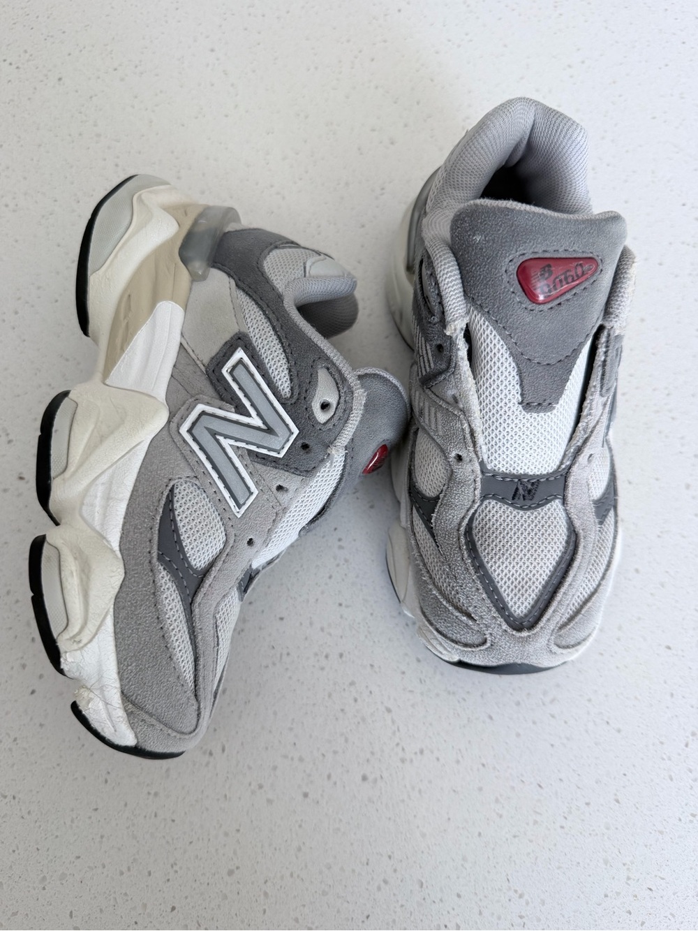 New Balance Kids Gray and White Athletic Sneakers with Subtle Red Accent